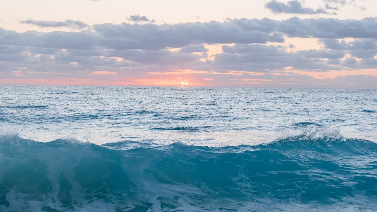 Ocean waves under a sunset along the Caribbean coast near Cancun