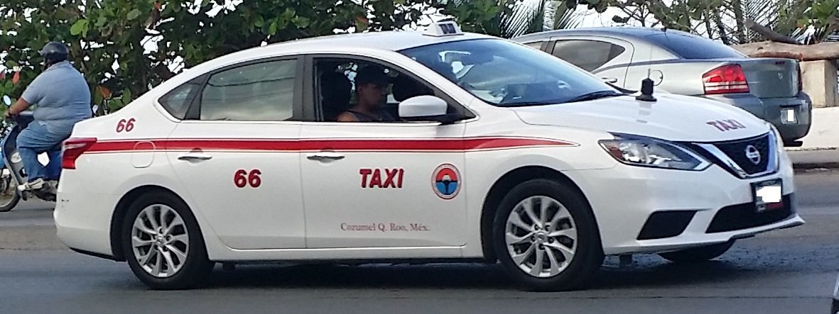 White Nissan Sentra sedan photographed in Quintana Roo, Mexico