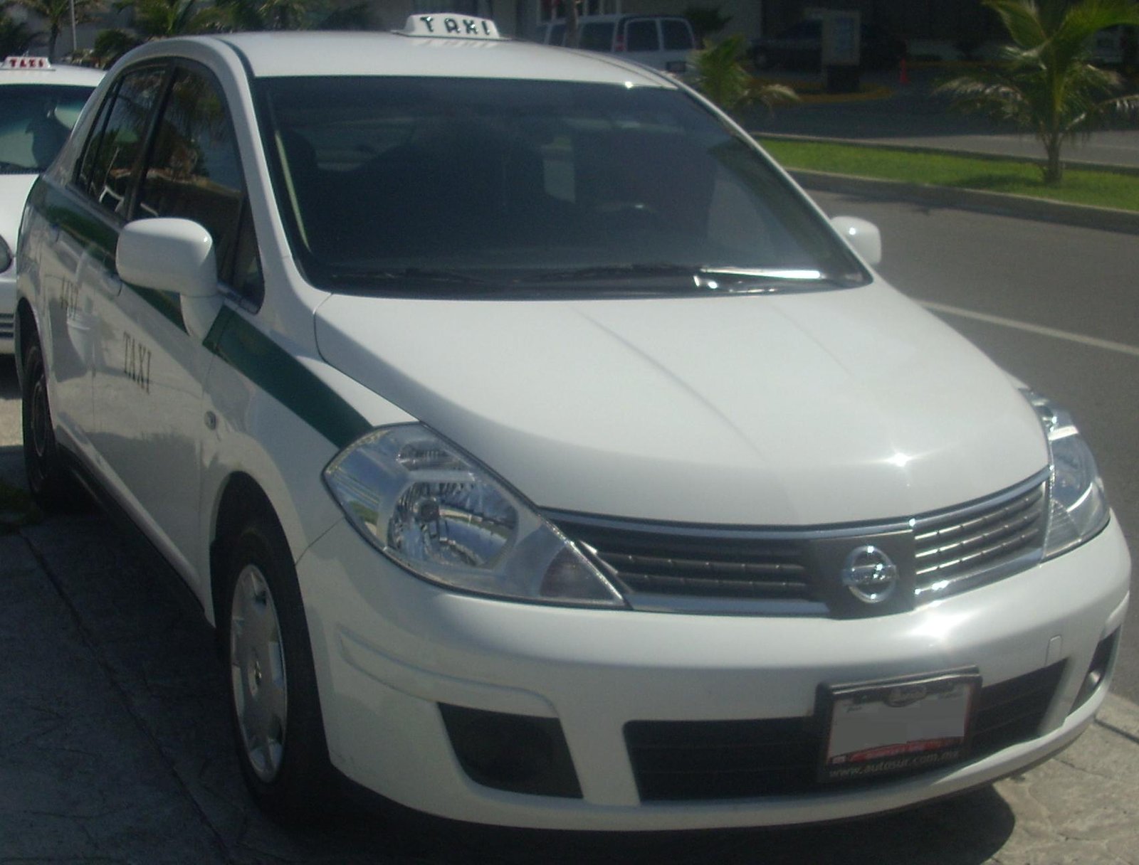 White Nissan Tiida sedan photographed in Cancun, Quintana Roo, Mexico