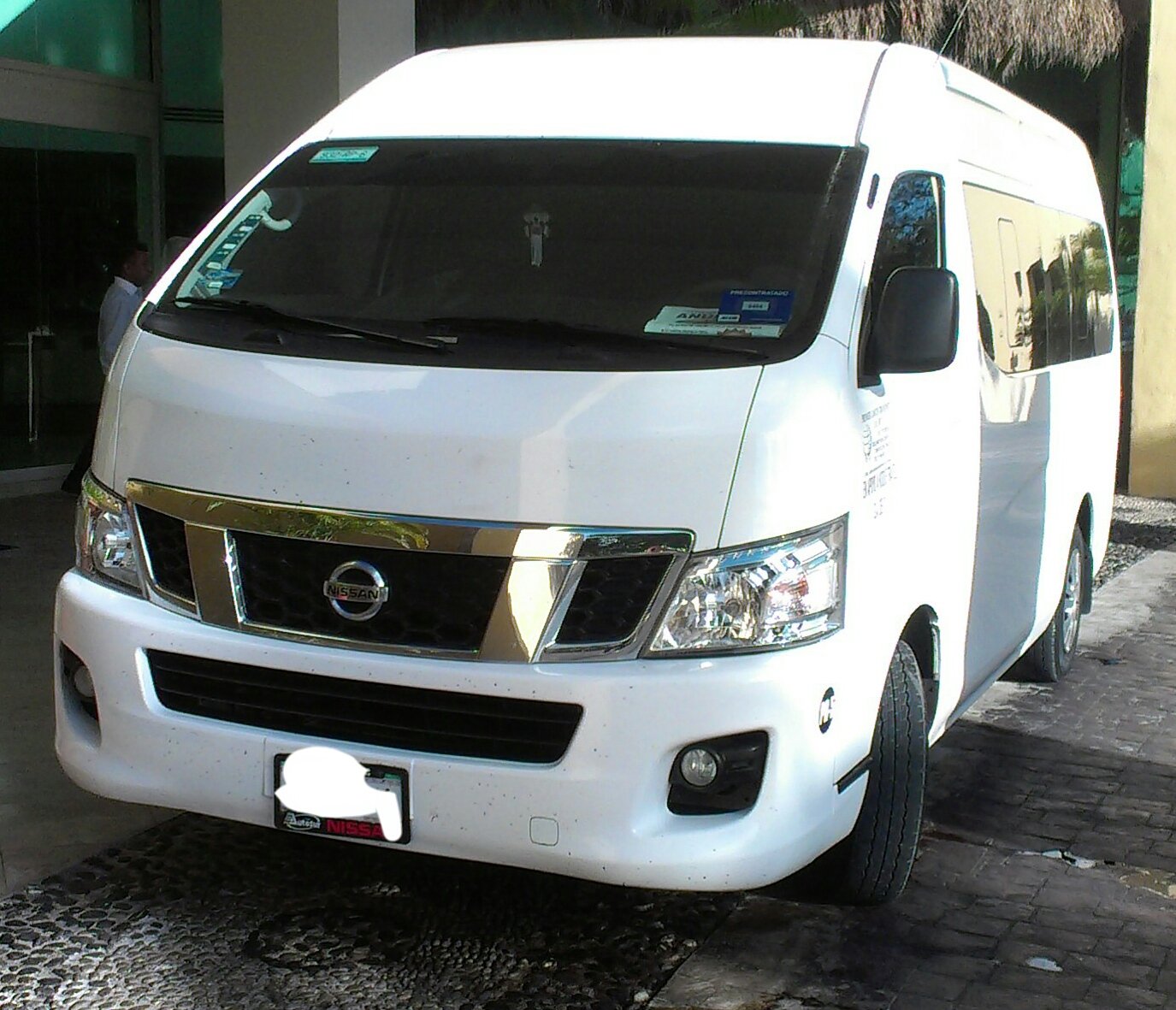 White Nissan NV350 Urvan passenger van photographed in Cancun, Quintana Roo, Mexico