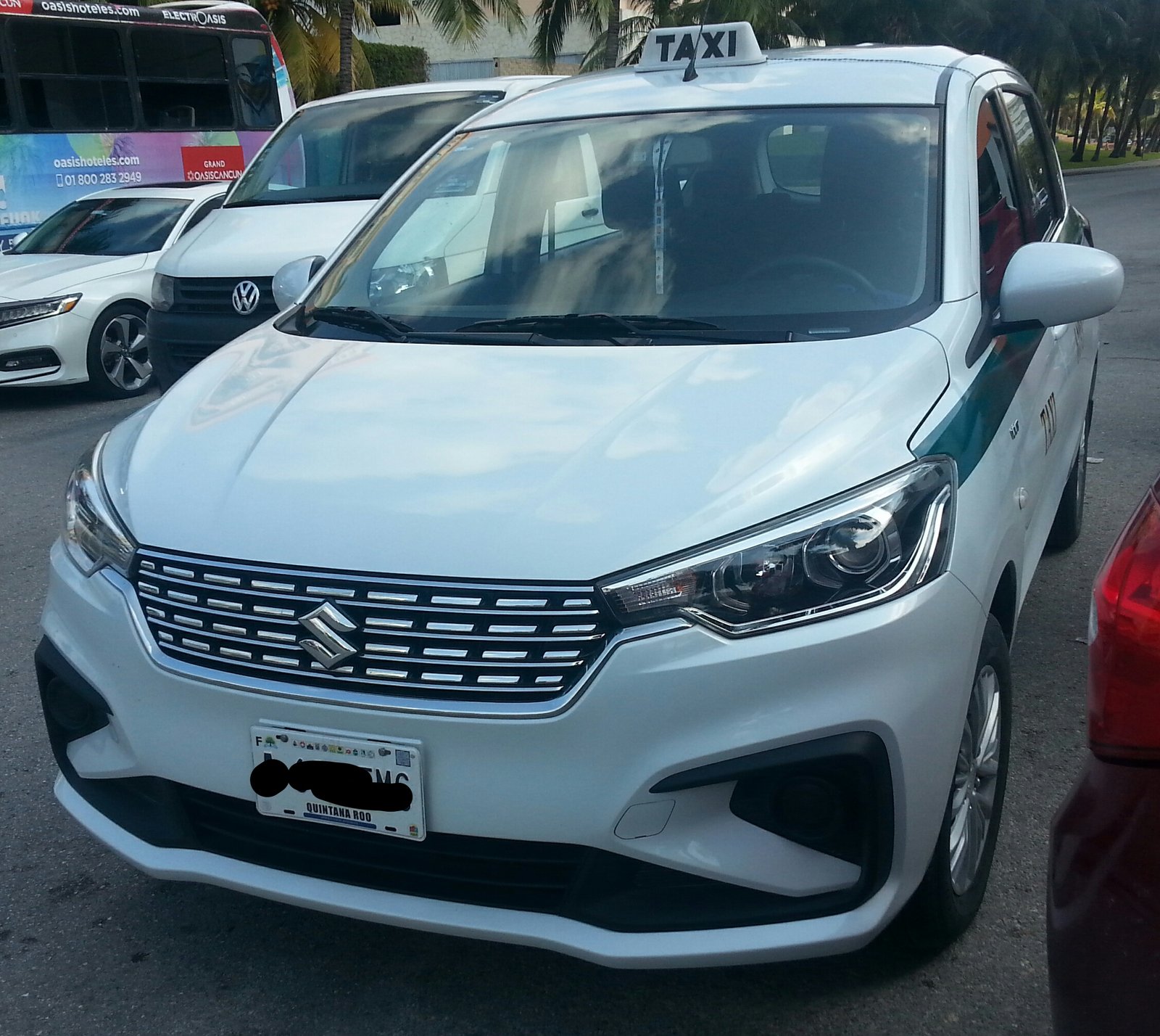White Suzuki Ertiga compact MPV photographed in Cancun, Quintana Roo, Mexico