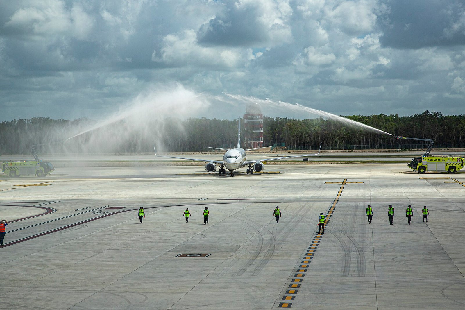 Aircraft on the runway at Felipe Carrillo Puerto International Airport in Tulum receiving a water salute