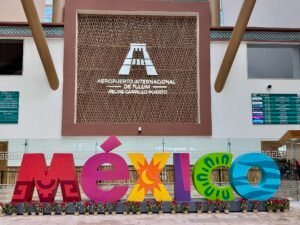 Entrance to Felipe Carrillo Puerto International Airport in Tulum with the colorful MEXICO letters