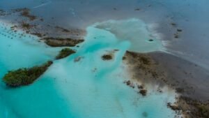 Aerial view of Bacalar Lagoon with turquoise and emerald water, Quintana Roo