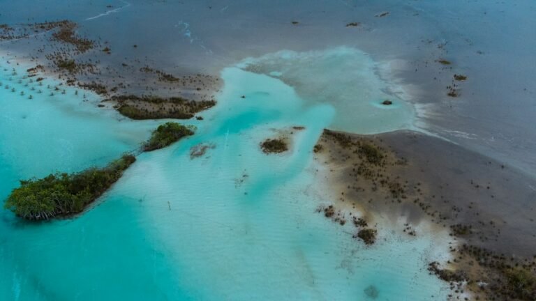 Aerial view of Bacalar Lagoon with turquoise and emerald water, Quintana Roo