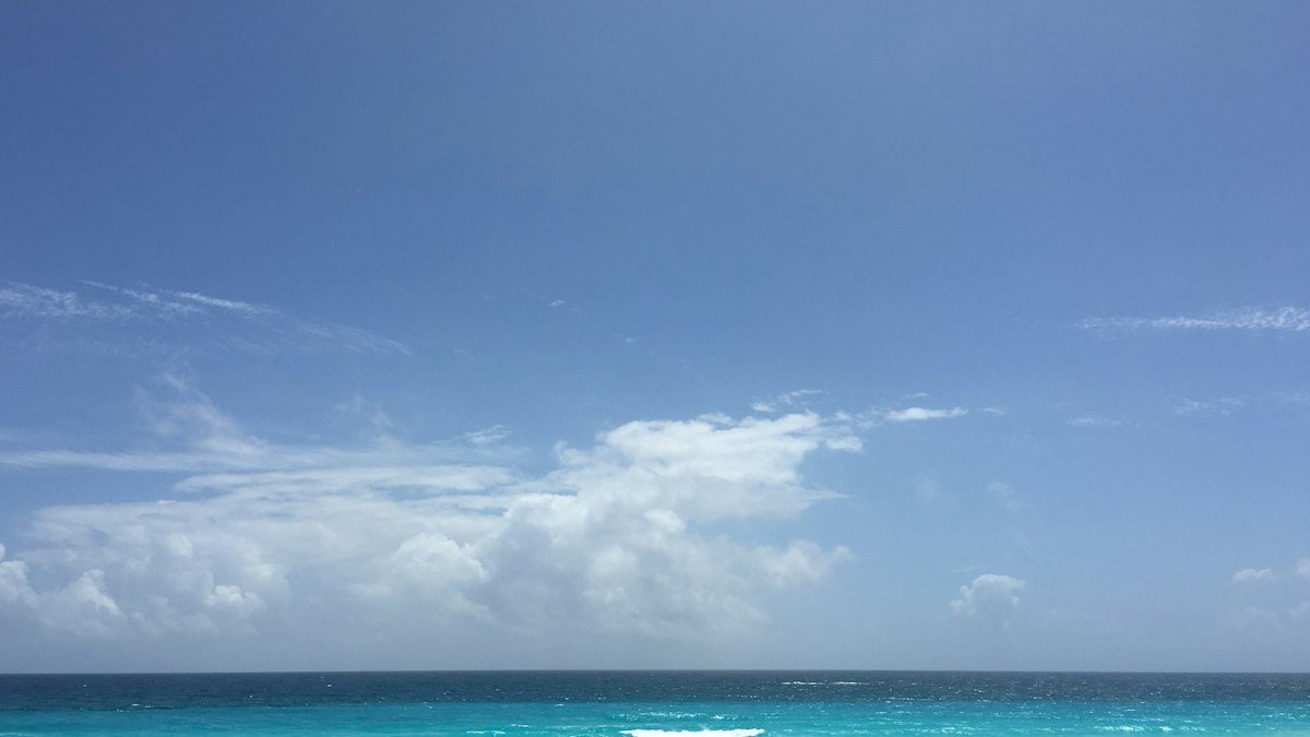 Blue sky and white clouds over the Caribbean Sea in Cancún