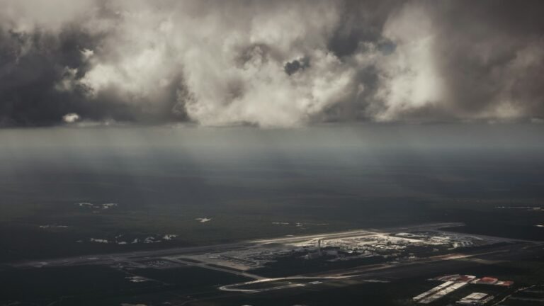 Wide view of clouds over the horizon at Cancún International Airport