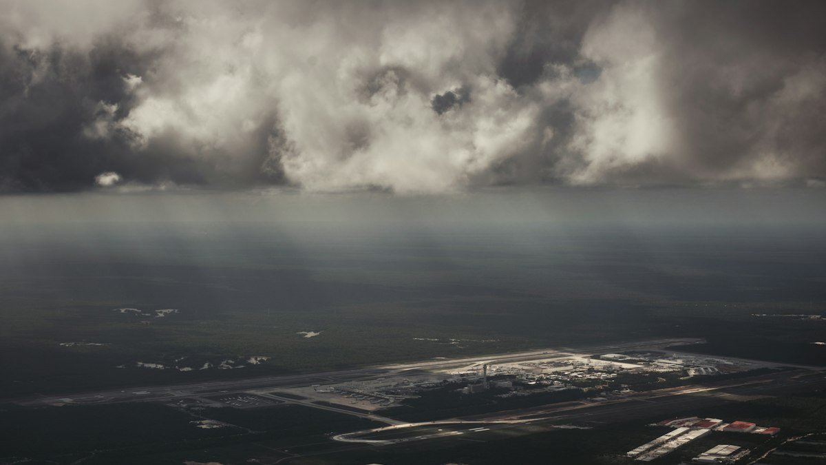 Wide view of clouds over the horizon at Cancún International Airport