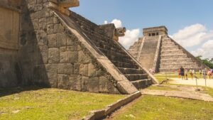 Stone serpent heads at the base of the stairs of El Castillo, the Temple of Kukulcán, Chichén Itzá