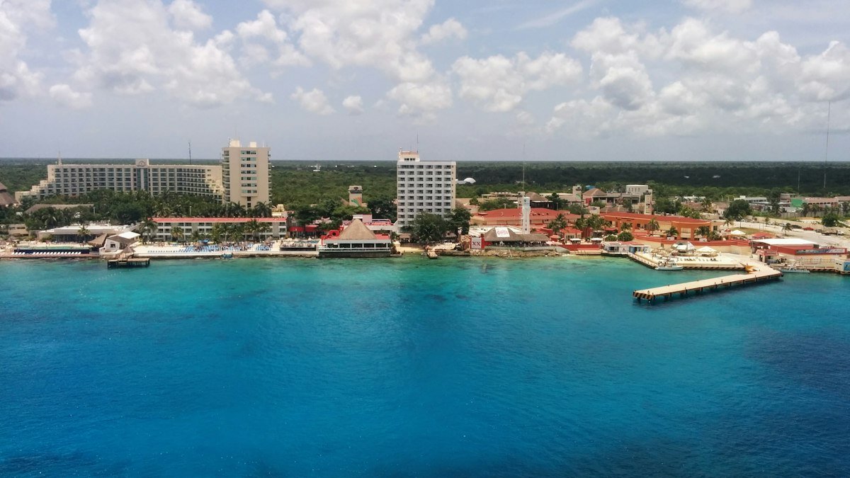 Aerial view of the waterfront and piers of San Miguel de Cozumel with turquoise water