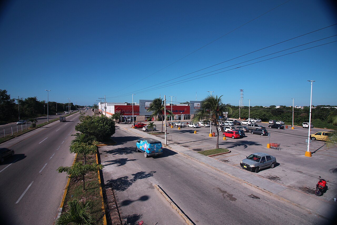 View from an overpass above Highway 307 with a small commercial plaza, Riviera Maya, Quintana Roo