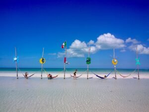 Hammocks standing in shallow water off the beach on Isla Holbox, Quintana Roo, Mexico