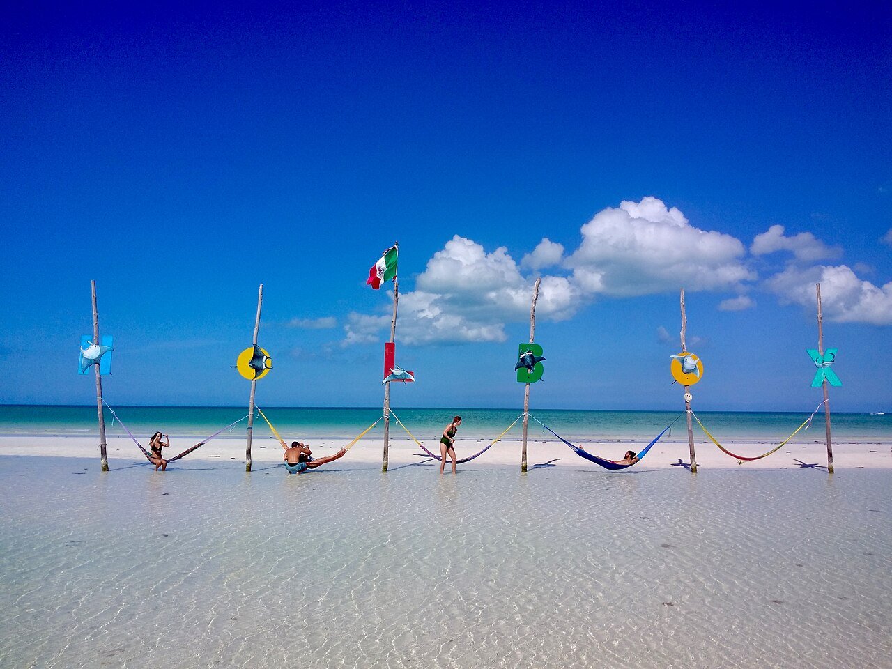 Hammocks standing in shallow water off the beach on Isla Holbox, Quintana Roo, Mexico
