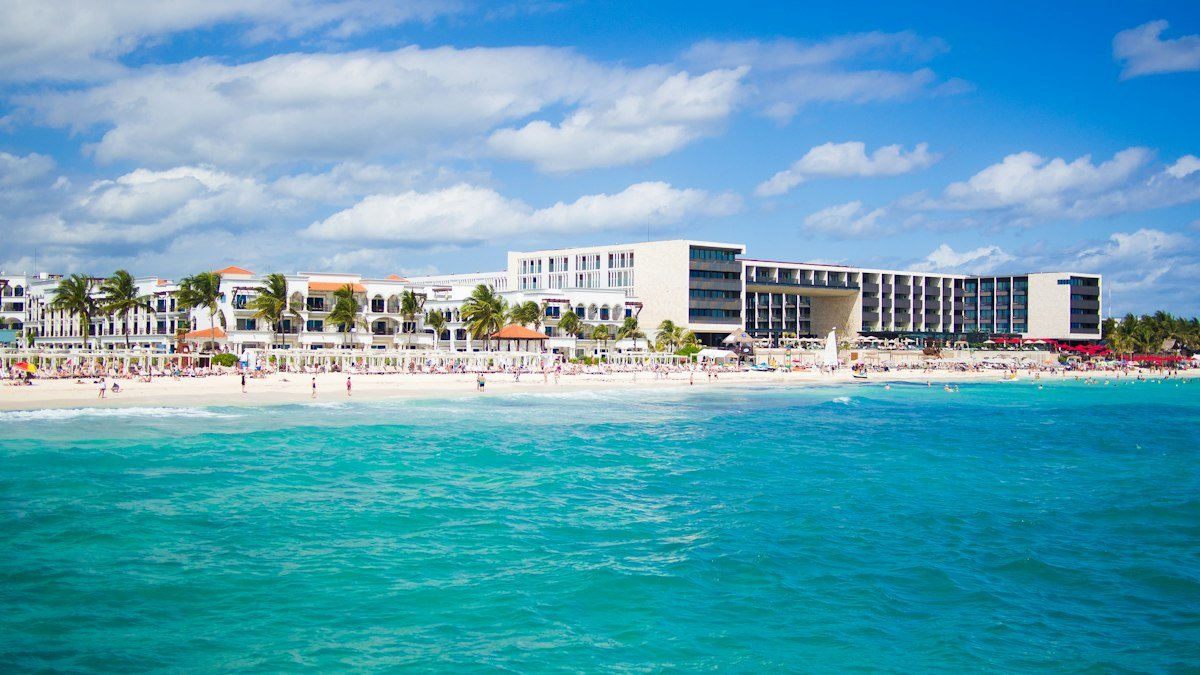 Playa del Carmen beach and low-rise hotels seen from the turquoise water