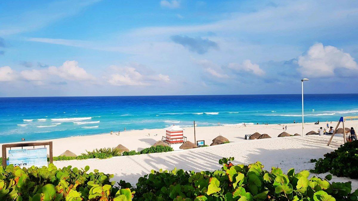 Playa Delfines in the Cancún Hotel Zone with white sand and turquoise water on a clear day