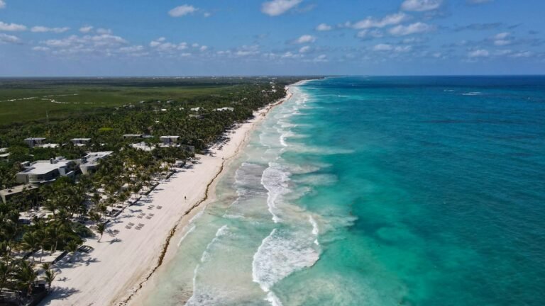 Aerial view of the long beach strip and jungle along the Tulum coast, Quintana Roo