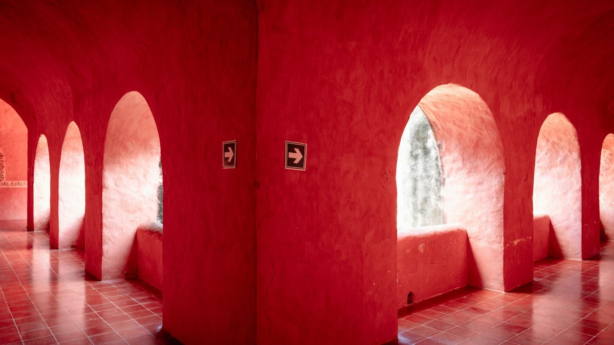 Red arched corridor of the Convento de San Bernardino de Siena in Valladolid, Yucatán