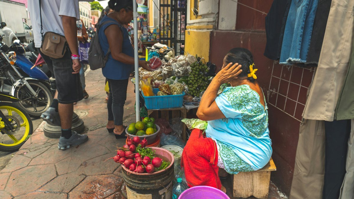 Street vendor selling fruit and radishes in the center of Valladolid, Yucatán